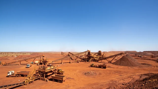 A crushing and screening operation under a wide blue sky